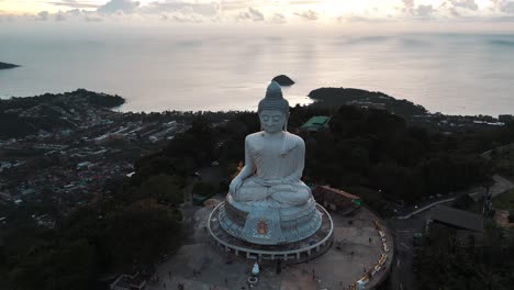 the big buddga statue at karon beach in phuket in thailand during sunset