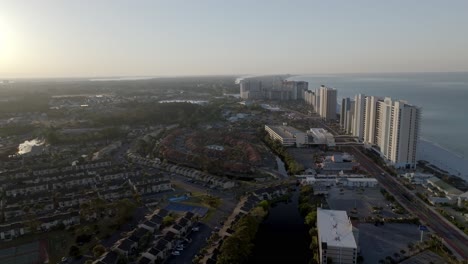early morning view of panama city beach, florida hotels and gulf of america with drone video moving in a circle.