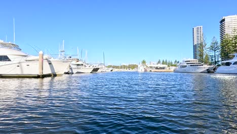 boats cruising along gold coast's scenic river