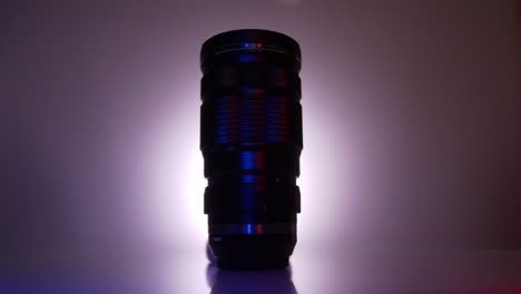 moody red and blue light swipe of mirrorless telephoto camera lens