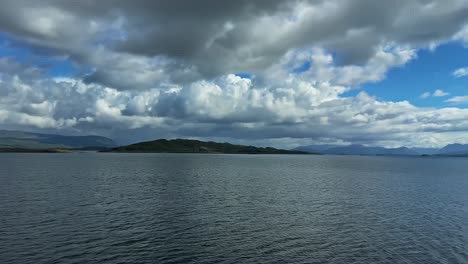 scottish lake and clouds in summer - drone shot