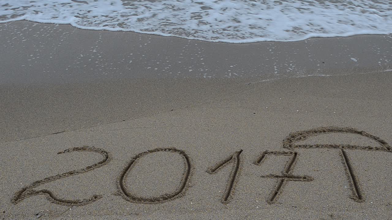 2017 in the form of an inscription on sand, the beach. Shooting on the beach