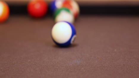 billiard balls hitting and rolling on the pool table