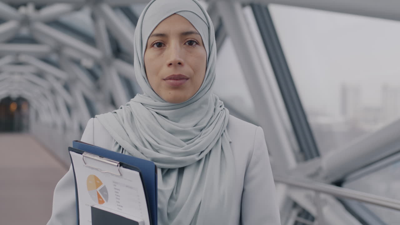Businesswoman in Hijab on a City Bridge