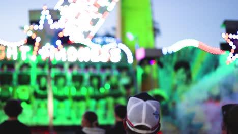 people enjoying a colorful carnival ride