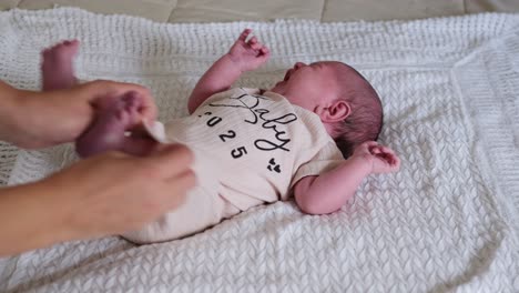 a little baby dressed in a cozy outfit is joyfully enjoying gentle touches and care during such a a sweet little baby dressed in a cozy outfit is joyfully enjoying gentle touches and care during such a peaceful moment