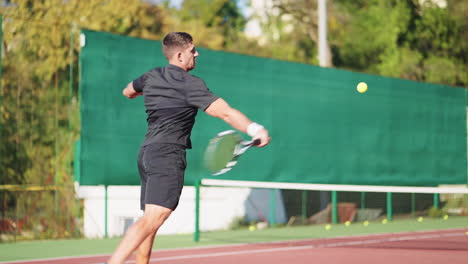 man playing tennis outdoor