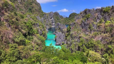 Drone footage of the Big Lagoon, revealing the majestic rocky hills around the Lagoon, part of Miniloc Island, Philippines