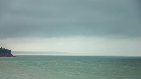 Timelapse-shot-of-dark-cloud-movement-over-sea-shore-on-a-cloudy-day