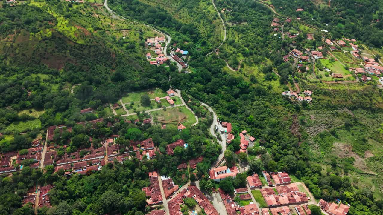 Picturesque aerial view of the historic colonial town of barichara, nestled in the green hills