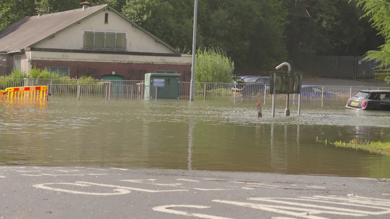 Flooding Scene with Submerged Cars and Building