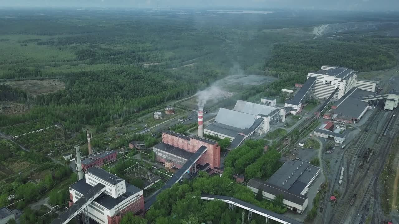 Aerial view of an industrial plant in a forested area