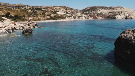 Aerial-of-Paradisiac-Azure-Sea-in-Aphrodite's-Rock-in-Paphos,-Cyprus