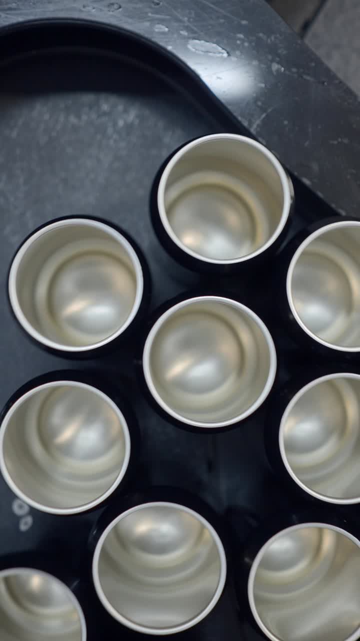 Top-down view of black and silver cylindrical containers