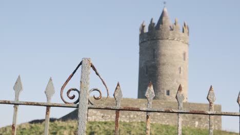 medium wide shot of a stone tower in ireland