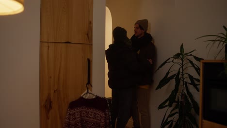couple indoors talking at night