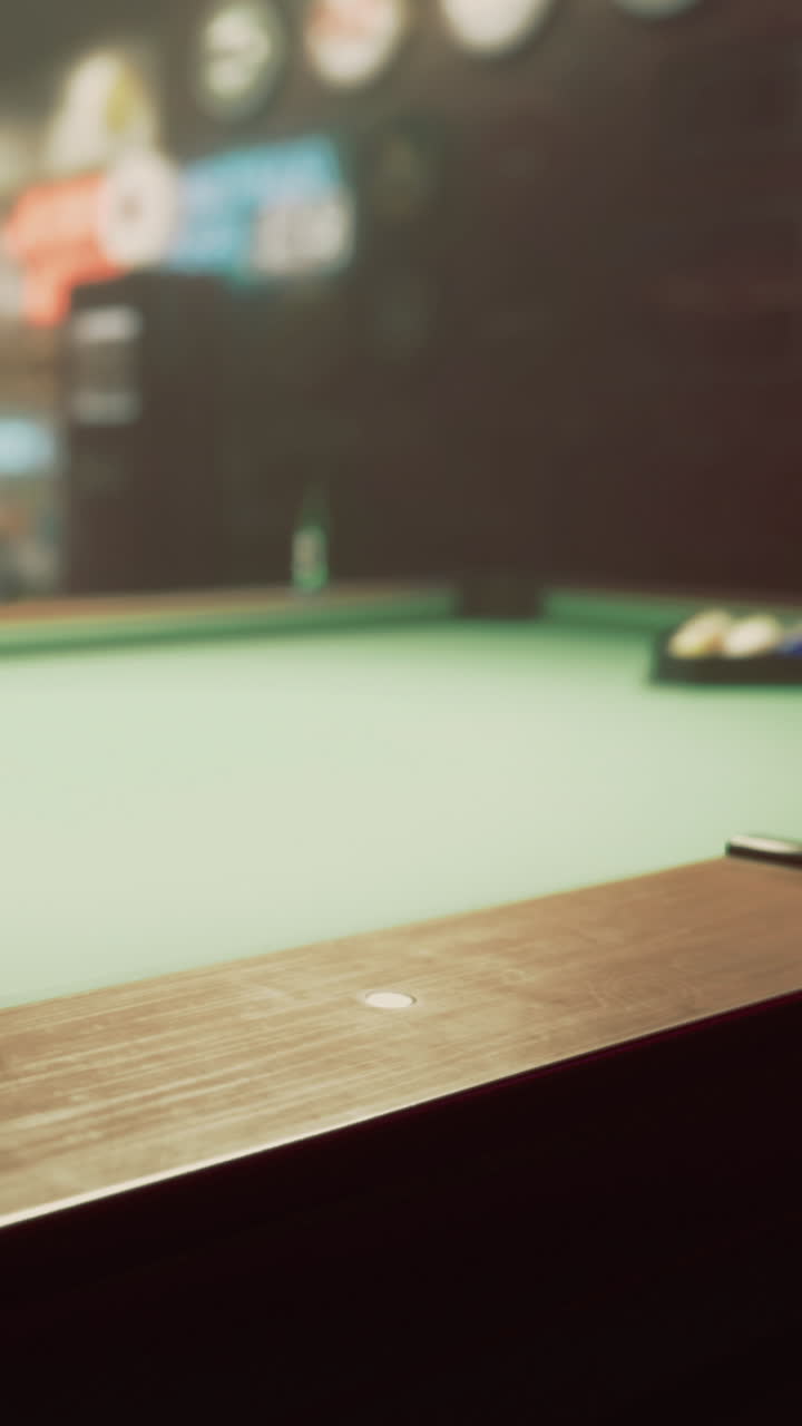 Pool table ready for a friendly game at a cozy bar in the evening