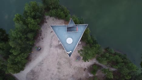 Aerial-shot-of-a-couple-standing-on-top-of-the-tower