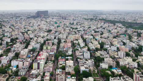 aerial drone view of nagole area in hyderabad city with sky and trees. day time, push in, moving down, drone shot, 4k