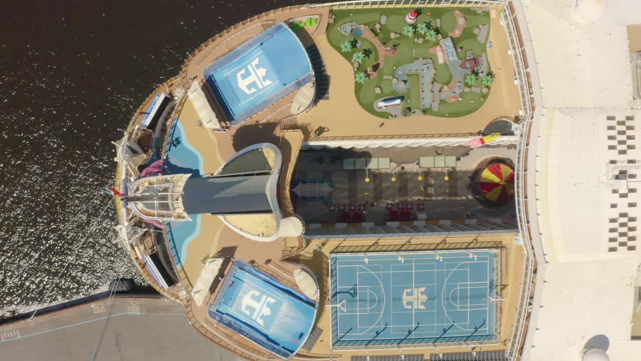 Aerial View of Cruise Ship Deck with Pools, Slides, and Activities