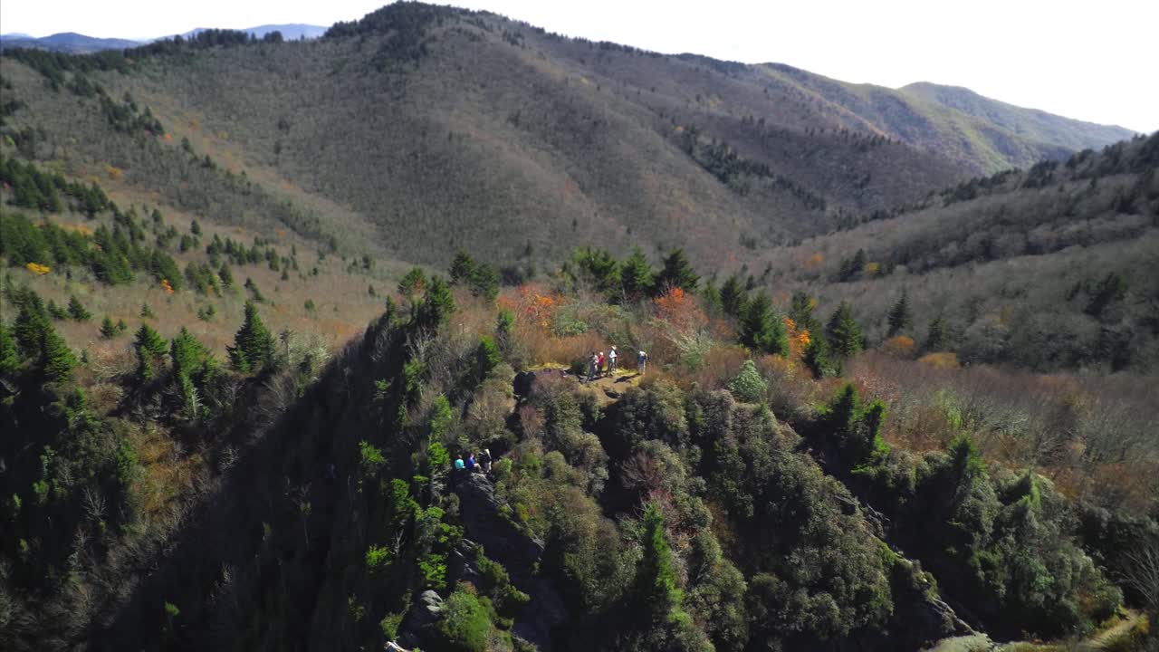 Aerial orbit around hikers visiting Charlies Bunion in the great smoky mountains. Beautiful and cinematic camera move