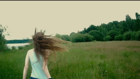 girl running through a field