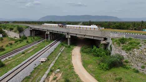 high-angle footage of the highway passing through a bustling suburban area