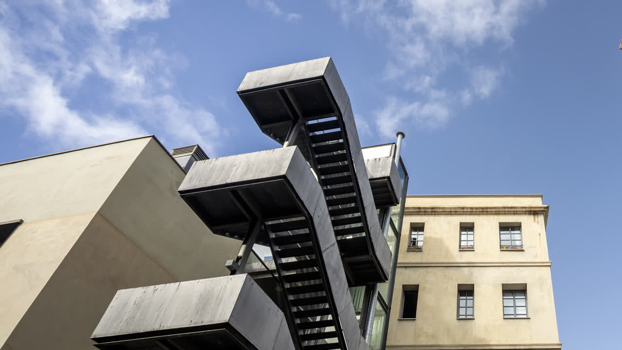 Old factory chimney and apartment buildings in barcelona