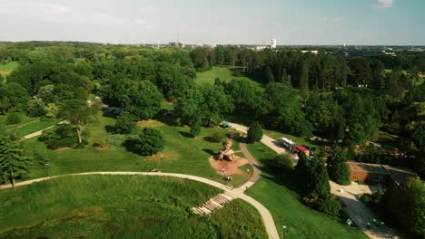 a tilt up shot of spring view of tourists walking on deck trail along with the beautiful garden