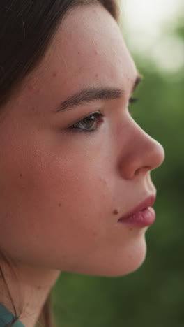 worried woman expresses bad mood on rainy day closeup. lady deals with anxiety attack looking at falling raindrops. instable mental health condition