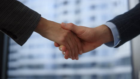 employee shaking hands at meeting