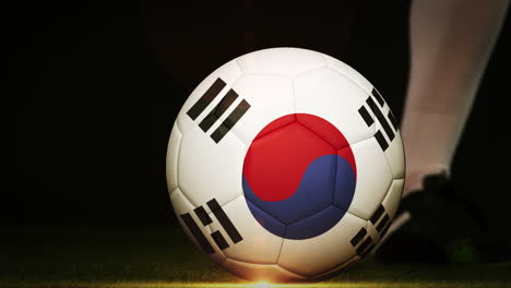 football player kicking korea republic flag ball