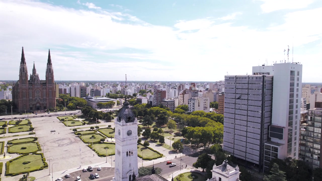 4K drone aerial view of Plaza Moreno in La Plata, Buenos Aires, Argentina. Historic central square surrounded by the Cathedral, government buildings, green spaces and the urban heart of the city.