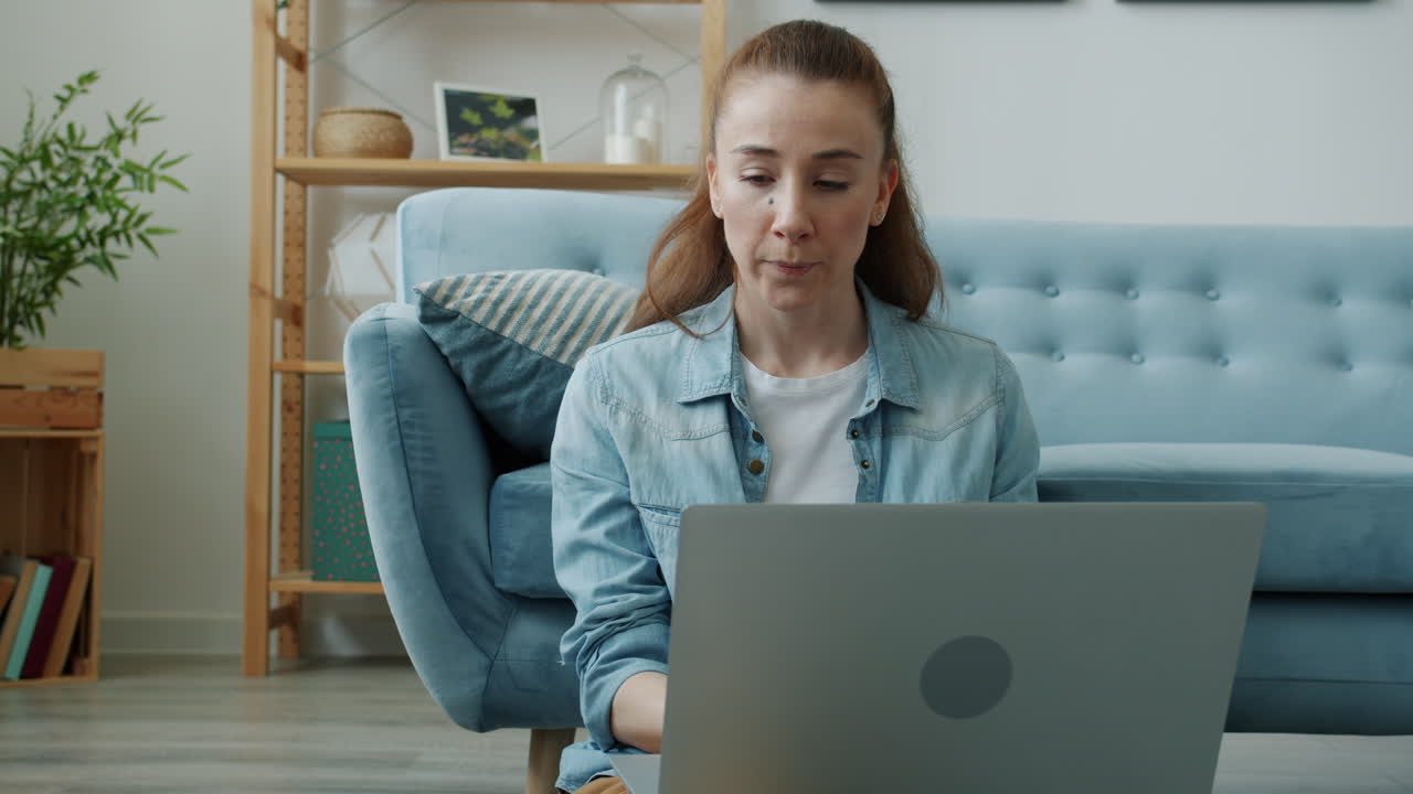 Woman Working on Laptop at Home