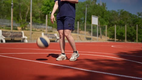 woman playing basketball on outdoor court