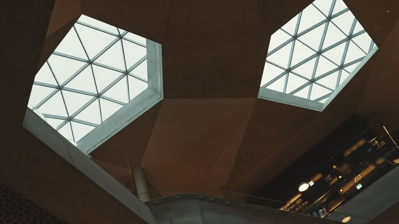 The geometric glass ceiling of the Deichman Library, highlighting its stunning architecture and modern design.