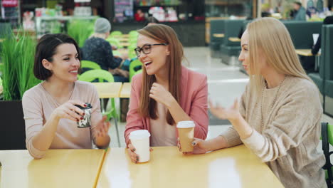 Happy Women Friends Enjoying Coffee