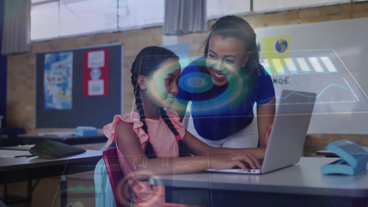 Teacher leaning over student typing on laptop in school, showing animated globe icon and chart
