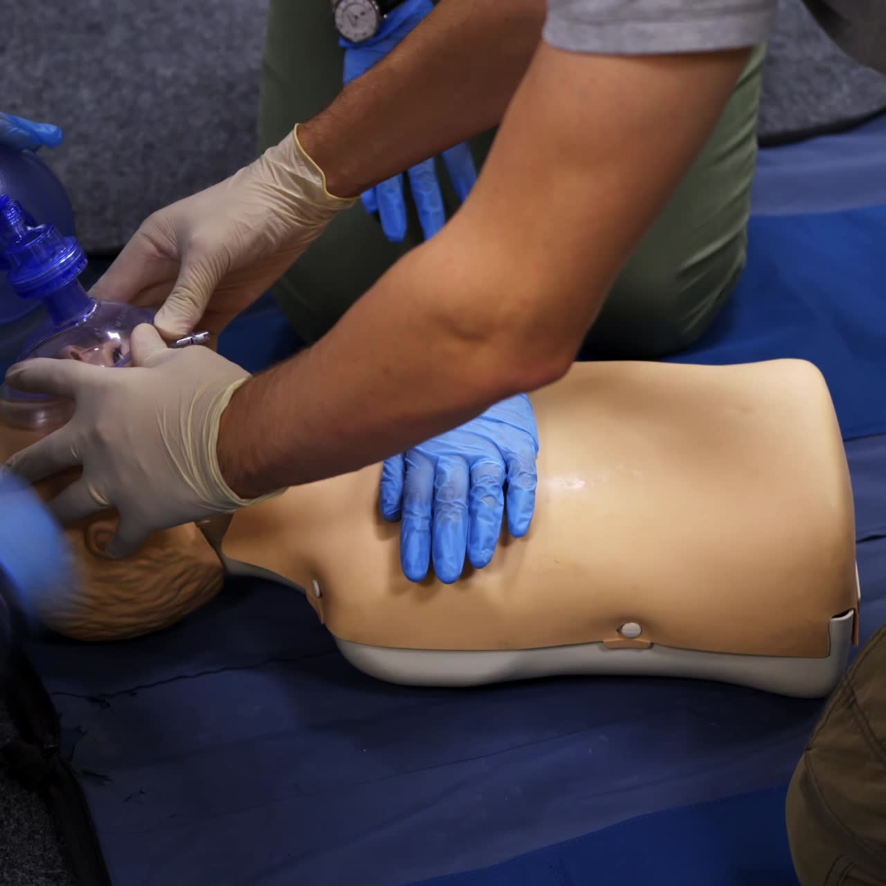 Medical education and practice. Medical mannequin doll for emergency aid. Practitioners train with artificial respiration on a dummy.
