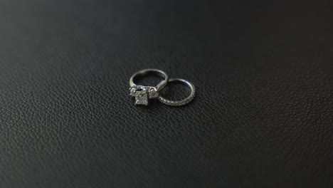 close up, slow motion shot of bride's wedding ring and engagement ring