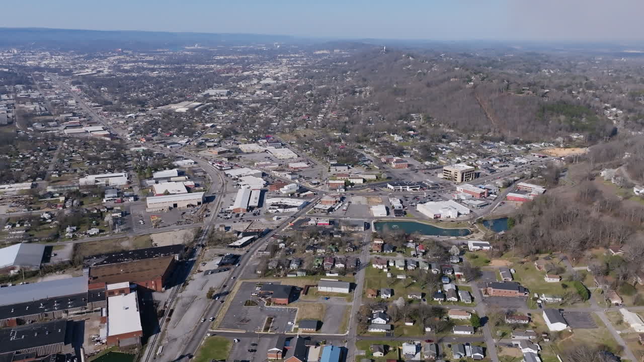 Wide aerial drone birds eye view footage of Rossville, Georgia in golden hour light.