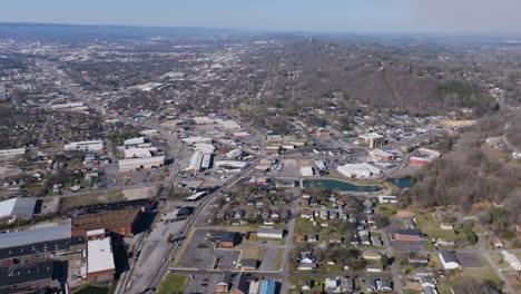 wide aerial drone birds eye view footage of rossville, georgia in golden hour light.