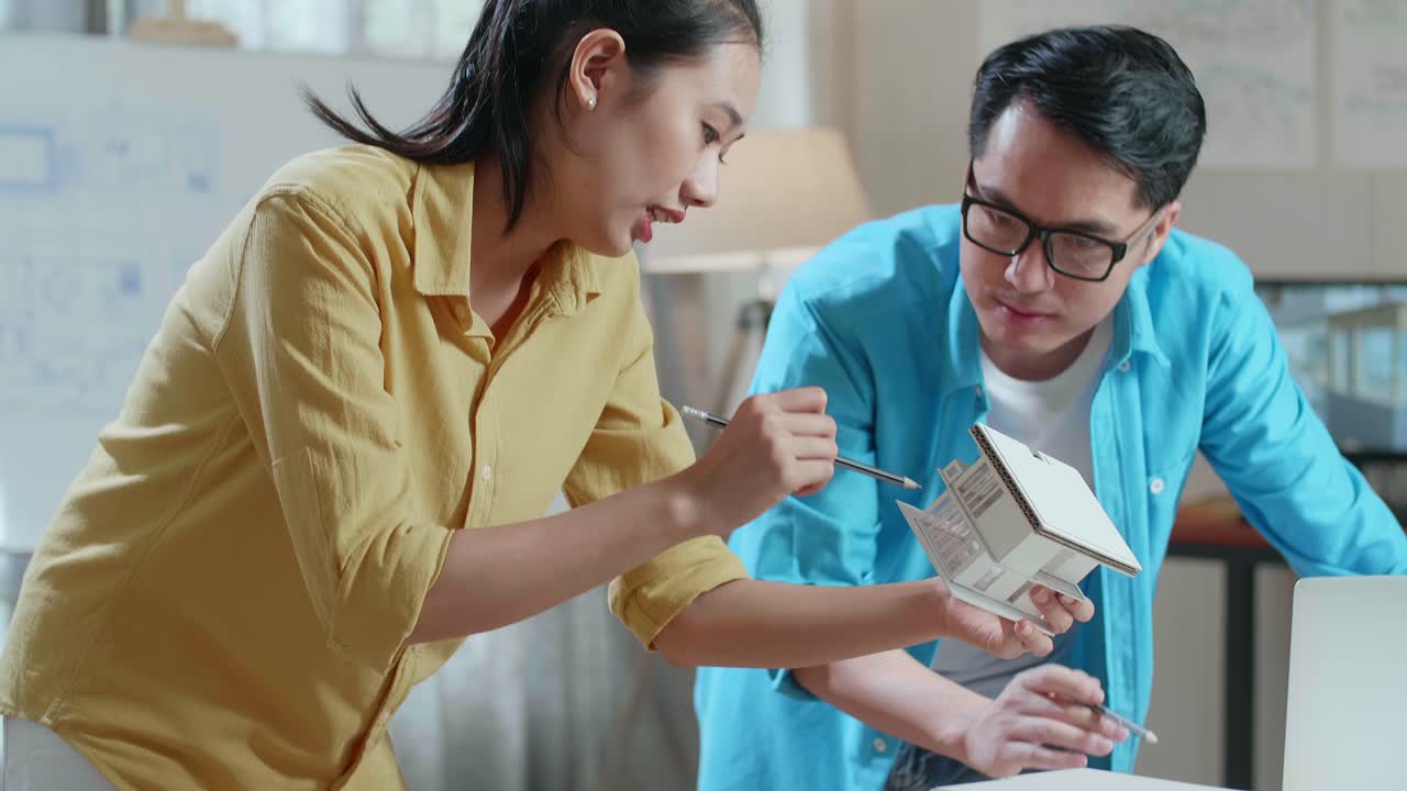 Team Discussing House Design Model