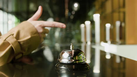 Close-up-view-of-reception-bell-on-a-counter