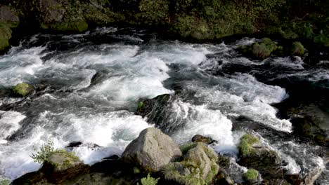 water flows through the stones, in slow motion