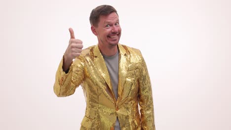 man in gold sequin jacket showing positive gestures and expressions