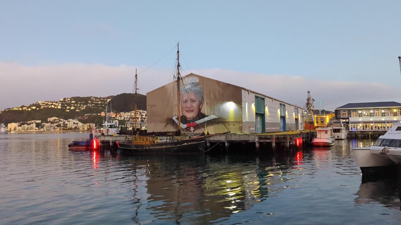 Mural of a Woman in Wellington Harbor at Dusk