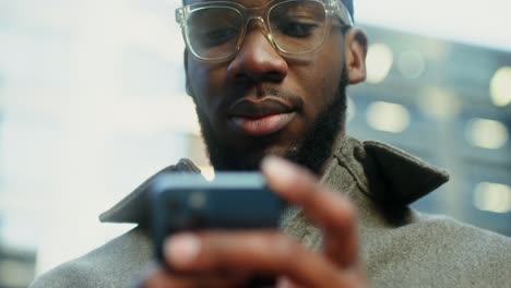man using a smartphone in the city