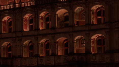 footage capturing windows of royal castle of blois, france during nighttime. vacant corridors.