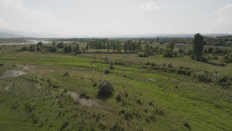 Countryside-plains-landscape-in-Georgia-with-highway-and-car-traffic